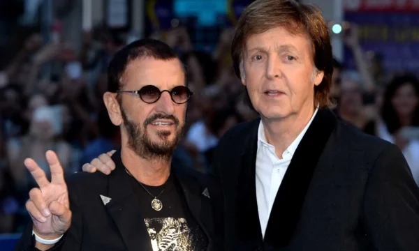Paul McCartney and Ringo Starr performing together, celebrating their surprise new duet "Home to Us"