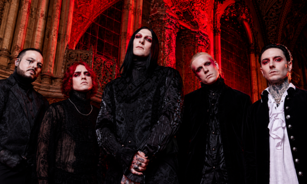 Motionless In White performing live on stage under red lighting during a recent tour