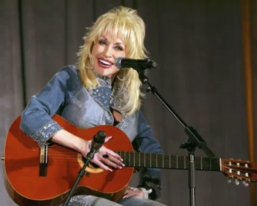 Dolly Parton smiling during a televised interview, representing her most memorable interview moments