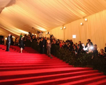 A dramatic Met Gala red carpet look worn by a musician, representing the most iconic designer collaborations in music fashion history