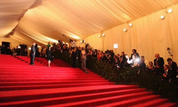 A dramatic Met Gala red carpet look worn by a musician, representing the most iconic designer collaborations in music fashion history