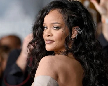 Rihanna speaking during an interview, representing her comments on balancing music and her beauty business
