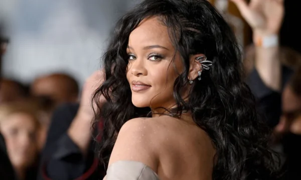 Rihanna speaking during an interview, representing her comments on balancing music and her beauty business