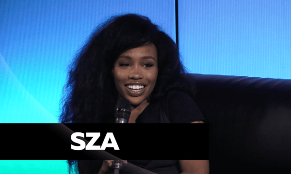 SZA speaking during a press interview, representing her honest remarks on creativity and self-doubt