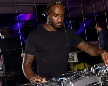 A streetwear-influenced runway look reflecting Virgil Abloh's design aesthetic and his impact on music and fashion culture