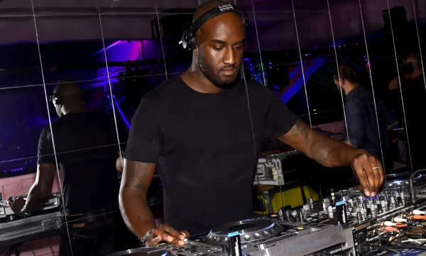 A streetwear-influenced runway look reflecting Virgil Abloh's design aesthetic and his impact on music and fashion culture