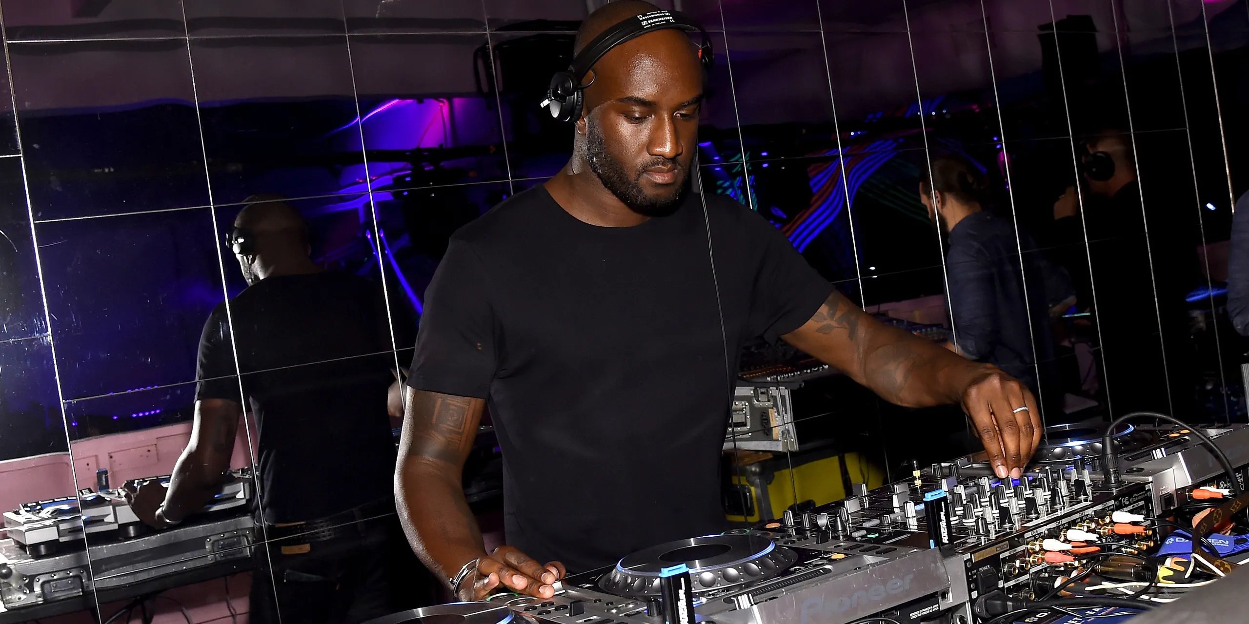A streetwear-influenced runway look reflecting Virgil Abloh's design aesthetic and his impact on music and fashion culture