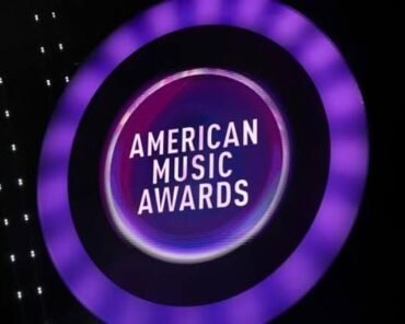 A smartphone displaying an American Music Awards voting screen, representing the ceremony's fan-driven voting process