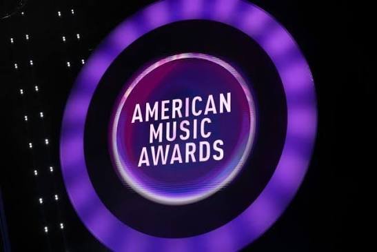 A smartphone displaying an American Music Awards voting screen, representing the ceremony's fan-driven voting process