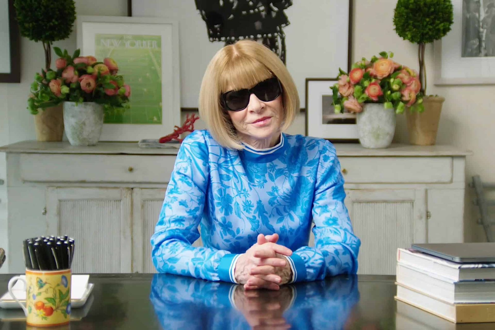 Anna Wintour attending a major fashion event, representing her far-reaching influence on music, fashion, and culture