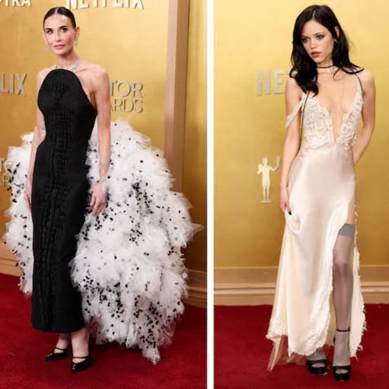 A fashion editor reviewing red carpet photos from award season, representing how best-dressed lists are compiled after major events