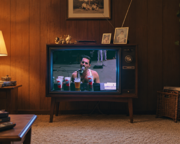 A vintage television displaying a classic music video, representing the evolution of the format as an art form