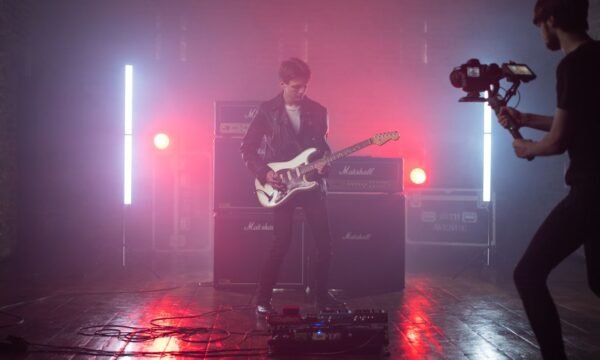 A stylized still from a music video featuring a bold fashion look, representing some of music's most iconic video fashion moments