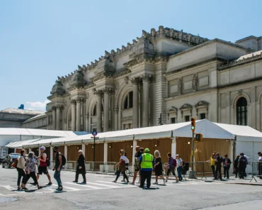 The Met Gala red carpet entrance, representing how the event's exclusive guest list is curated each year