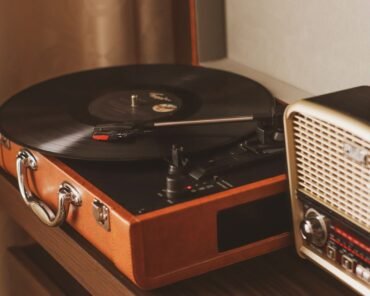 A vinyl record being placed on a turntable, representing the format's ongoing resurgence in popularity