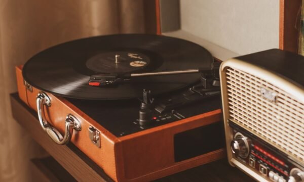 A vinyl record being placed on a turntable, representing the format's ongoing resurgence in popularity