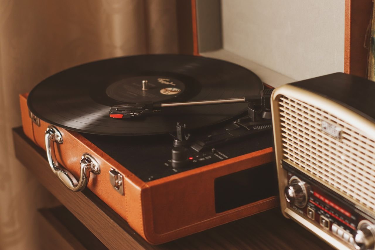 A vinyl record being placed on a turntable, representing the format's ongoing resurgence in popularity
