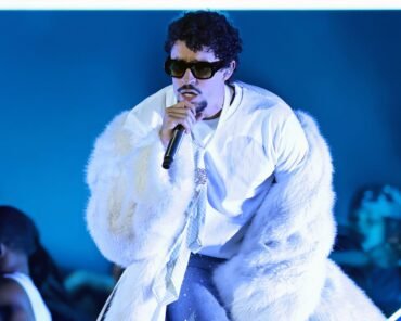 Bad Bunny performing on stage, representing his rise from Puerto Rico to global music stardom