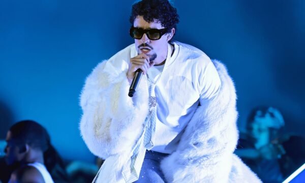 Bad Bunny performing on stage, representing his rise from Puerto Rico to global music stardom