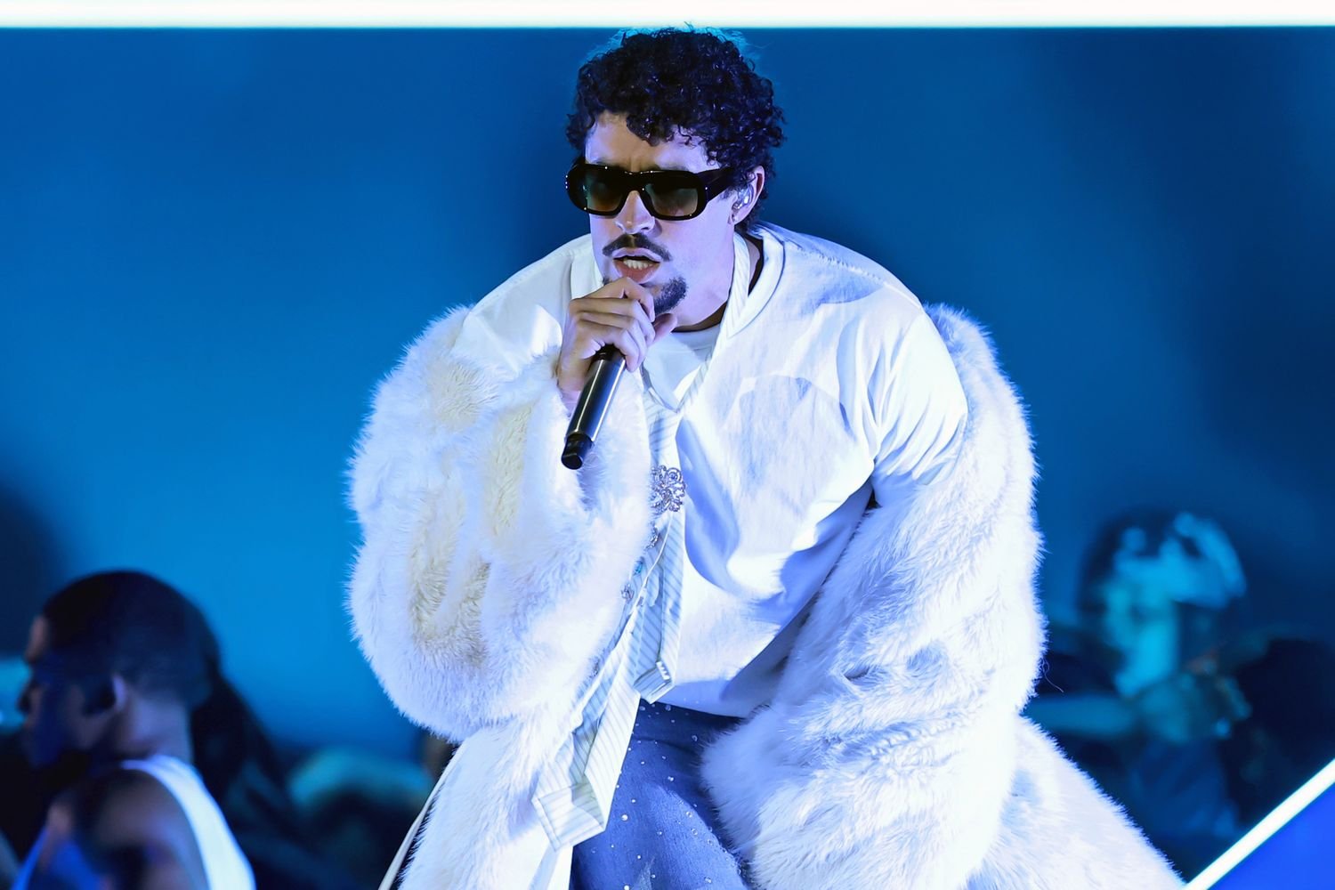 Bad Bunny performing on stage, representing his rise from Puerto Rico to global music stardom