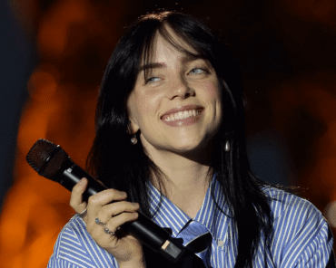 Billie Eilish performing live, illustrating her rise from bedroom recordings to major pop stardom