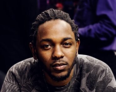 Kendrick Lamar performing on stage, representing his career timeline and cultural impact