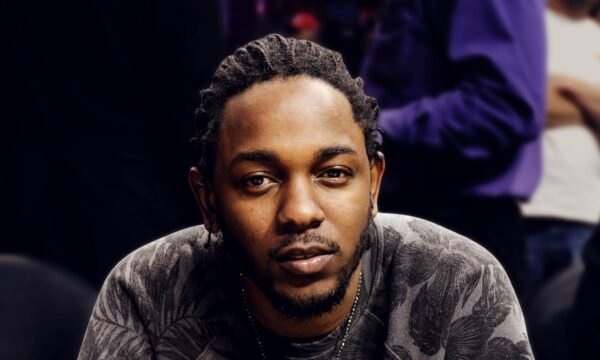 Kendrick Lamar performing on stage, representing his career timeline and cultural impact