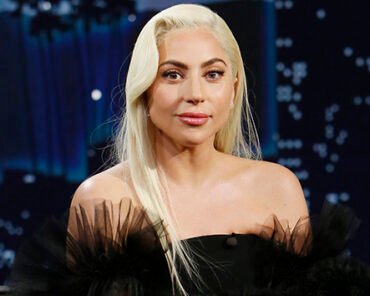 Lady Gaga performing on stage, representing the many reinventions across her career