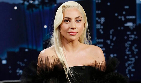 Lady Gaga performing on stage, representing the many reinventions across her career