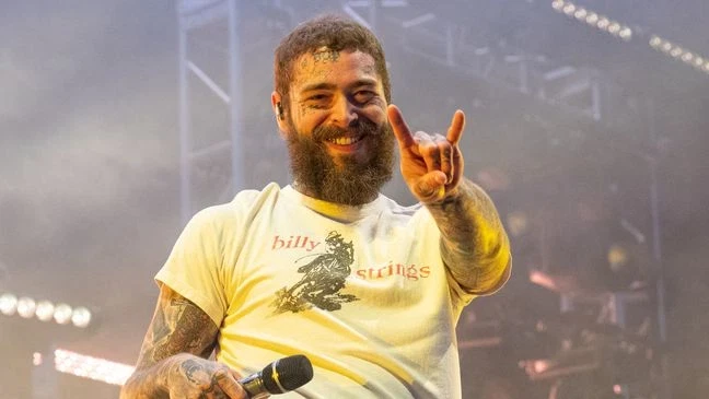 Post Malone performing on stage, representing his path from SoundCloud artist to mainstream stardom
