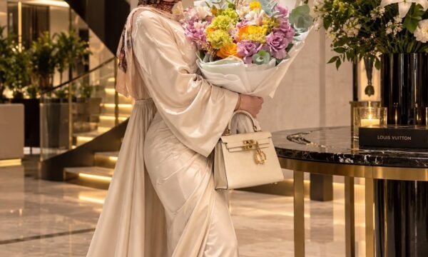 May Ahmed, founder of H&T Boutique, with one of her luxury handbag designs